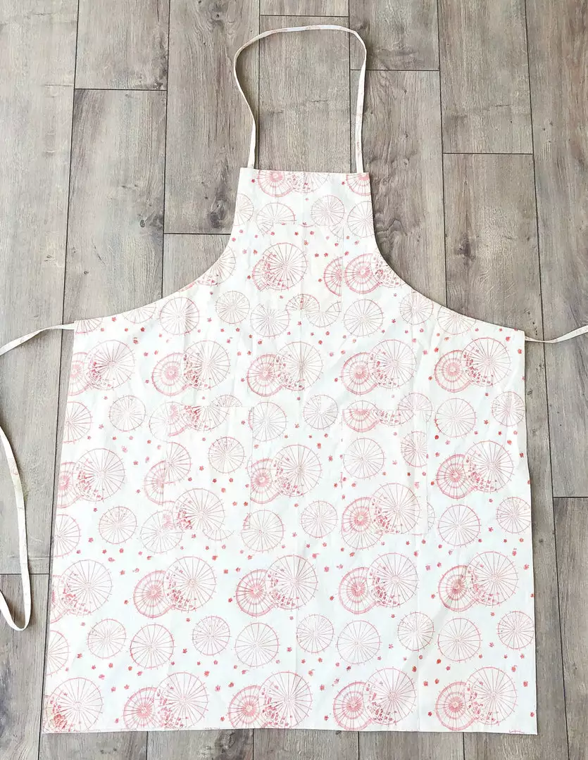 Symbology Dancing Umbrellas + Ginkgo Leaf Reversible Apron Home Goods 3 Symbology Dancing Umbrellas + Ginkgo Leaf Reversible Apron Home Goods