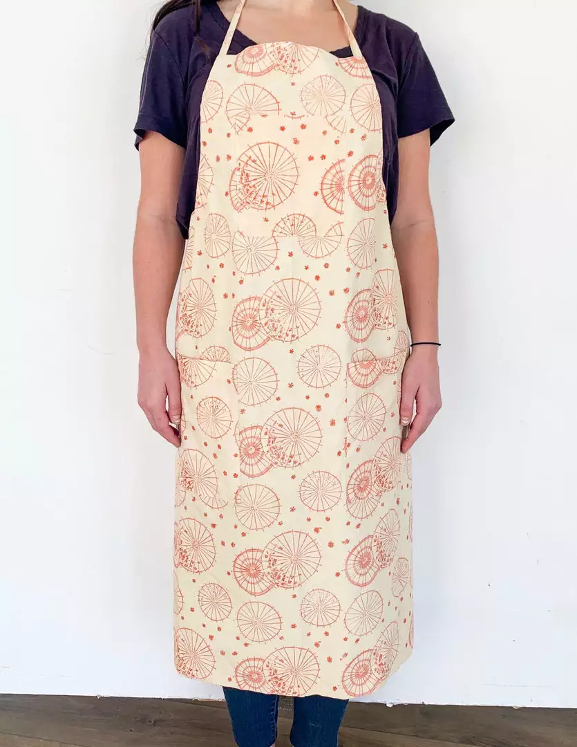 Symbology Dancing Umbrellas + Ginkgo Leaf Reversible Apron Home Goods 1 Symbology Dancing Umbrellas + Ginkgo Leaf Reversible Apron Home Goods